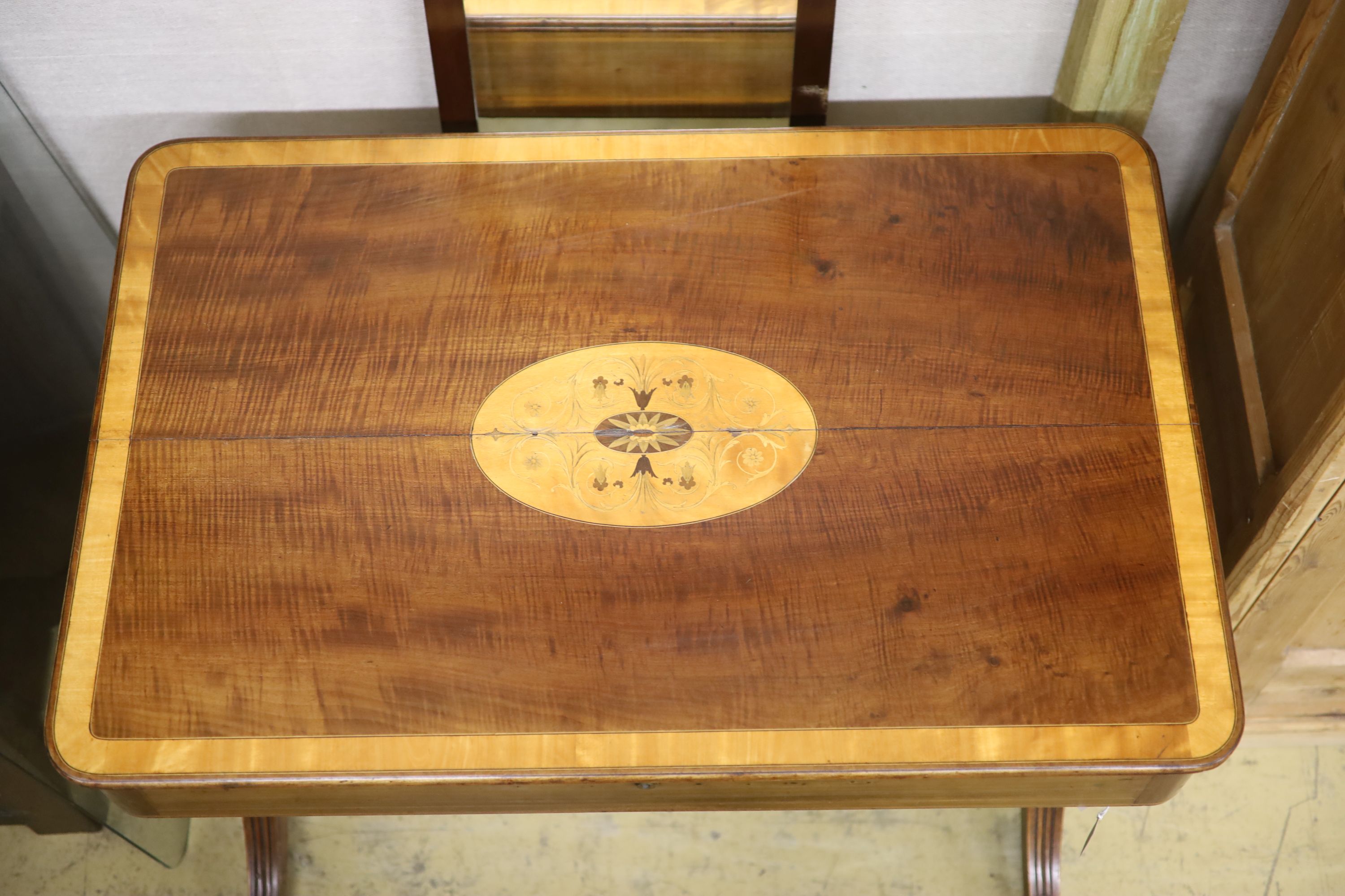 A Regency satin banded inlaid mahogany hinged top writing table, width 93cm depth 61cm height 75cm